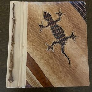 Handmade photo album, not positive what it’s made of, leaves, husks, bark?
